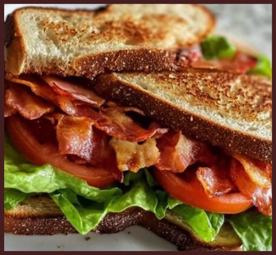 A thick bacon, lettuce, and tomato sandwich