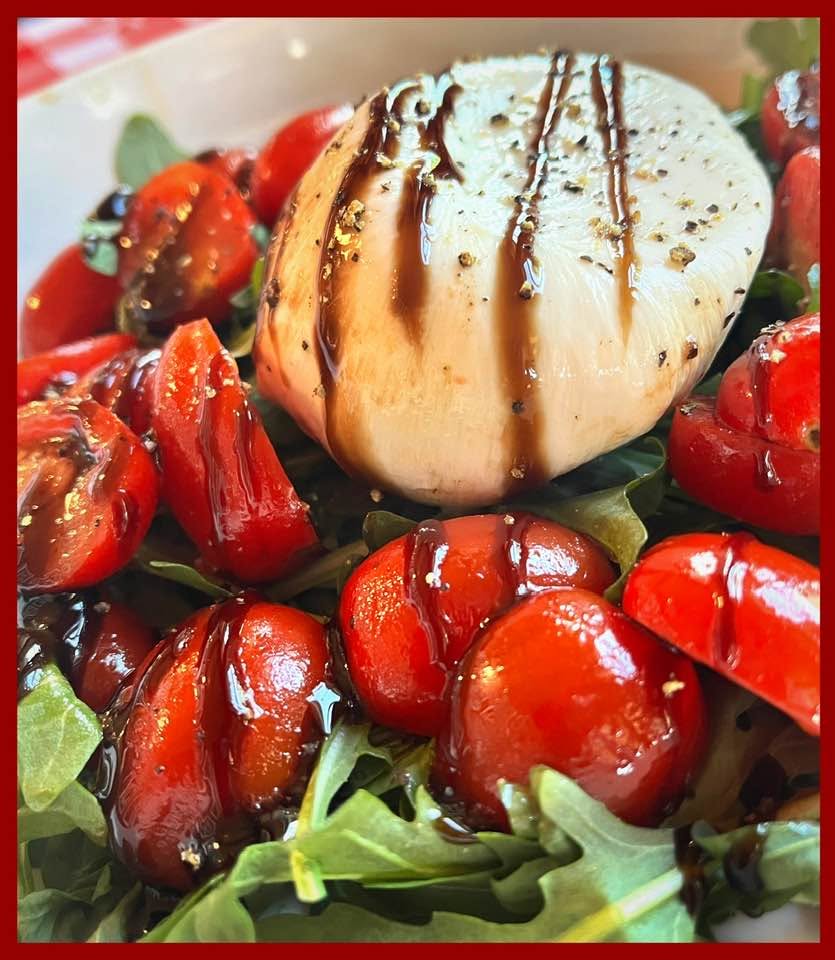 Burrata with roasted tomatoes, greens, and balsamic