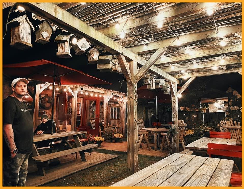 The outdoor dining area glowing at night