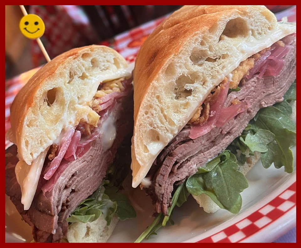 A roast beef sandwich on a crusty roll